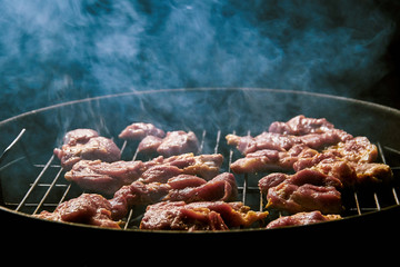 Fresh meat on the grill with black background