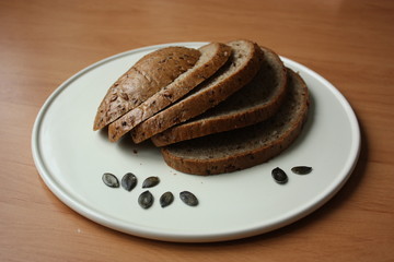 grain bread sliced on a white plate