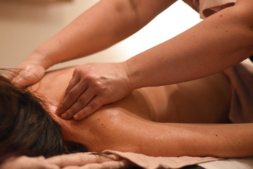 Fototapeta na wymiar Woman having back massage. Body care, woman having massage in spa
