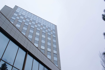 Modern office building with gray walls and blue windows