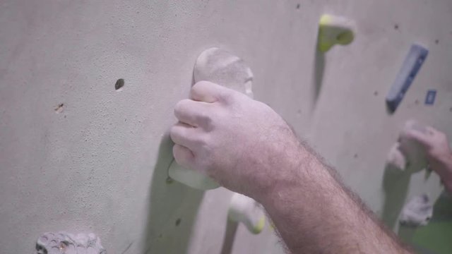 indoor climber climbing bouldering exercise leisure wide shot gimbal man slow motion