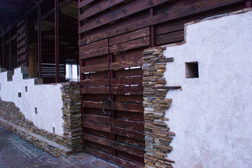 Wall with old wooden door and tile