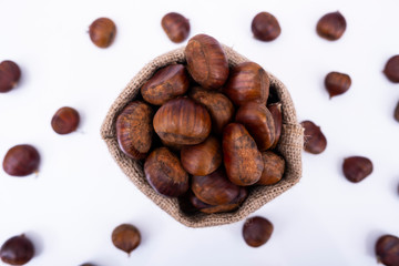 Fototapeta premium Top view macro photo of chestnuts