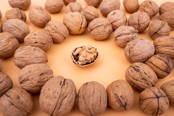 Walnuts on yellow solid background