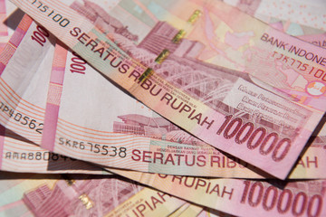 Close up of Indonesian money, 100,000 IDR banknotes 