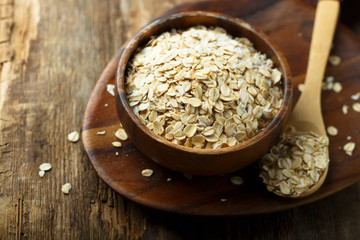 Organic oats in wooden bowl