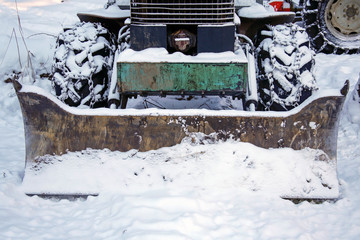 closeup of snow plough tractor