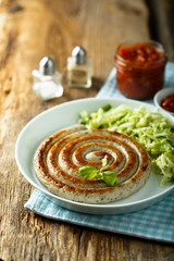 Fried sausage with cabbage salad