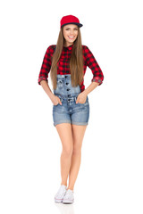 Happy Young Woman Posing In Jeans Shorts And Red Full Cap