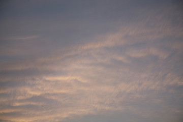 Sky clouds as the best picture. The most abstract background image of the sky. Beautiful sunset. The sun  rays illuminate the clouds.