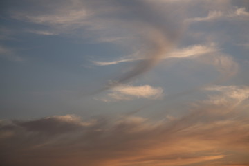 Autumnal weather affects the clouds and sky. The bright colors of heaven are transmitted to the clouds in the sky. Beautiful background on the cloudy image of the air space.