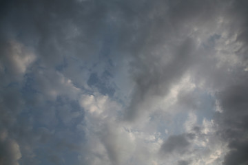 The bright background of the sky is covered with beautiful clouds. Very light clouds and sky soar across the horizon. Wind accelerates paint with a blue background image of nature.