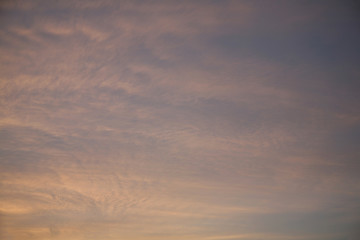 Sky clouds as the best picture. The most abstract background image of the sky. Beautiful sunset. The sun  rays illuminate the clouds.