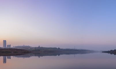 The view of the embankment of the Kalmius river in a lilac mist 2