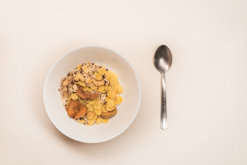 cornflakes with milk on white plate