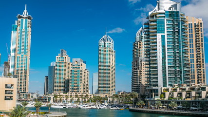 Fototapeta na wymiar View of Dubai Marina modern Towers in Dubai at day time timelapse