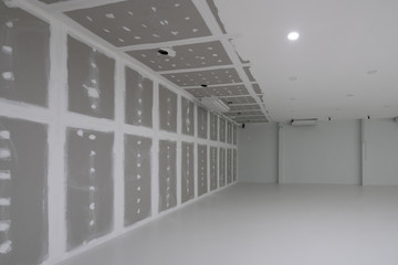 Empty factory during decorate interior, warehouse, hall interior with down light.