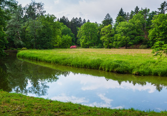 Fototapeta na wymiar Water channel in summer park