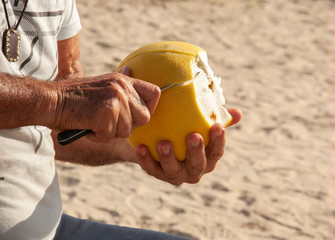 the man cleansing pomelo from the peel