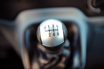Car interior. manual transmission gear shift. Gray color
