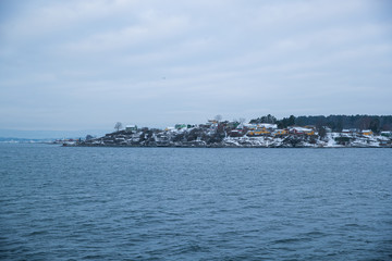 Overlooking the coast of the islands around Oslo Norway over the winter overlooking the sea and the Fjord