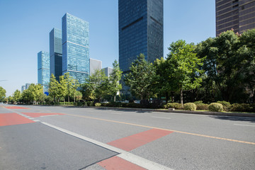 Obraz premium Empty road floor surface with modern city landmark buildings of hangzhou bund Skyline,zhejiang,china