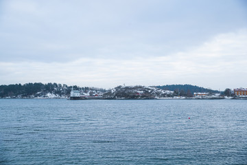 Overlooking the coast of the islands around Oslo Norway over the winter overlooking the sea and the Fjord during day.