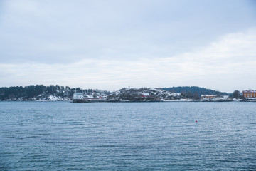 Overlooking the coast of the islands around Oslo Norway over the winter overlooking the sea and the Fjord during day.