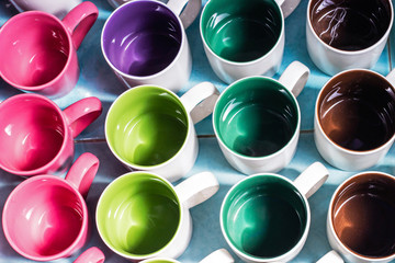 Colorful ceramic glass mug in different shape and form. Top view