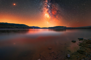 Milky way galaxy on the lake. Night landscape 
