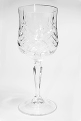 Cutout of a decorated crystal wine goblet on white background