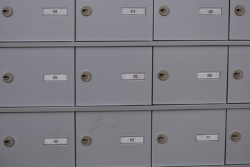 Outdoor brushed aluminum locking mailboxes in a mobile home RV park 