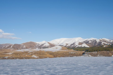 Frozen lake and beautiful mountains.