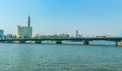 Fototapeta na wymiar Panorama of the Nile River, view of the Cairo city bridges buildings and pyramids