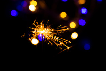 Christmas golden lights. Background of bright glow bokeh