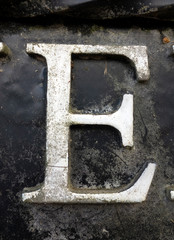 Written Wording in Distressed State Typography Found Letter E