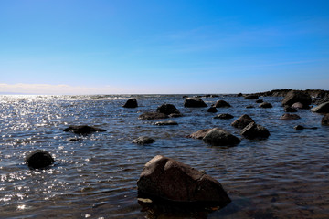 Evening Sunlit Rocks at a Coastal Beach