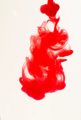 Color drop in water on a white background close-up, abstraction