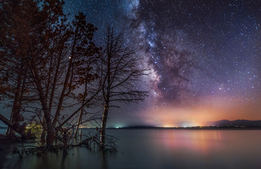 Milky way galaxy on the lake. Beautiful  night landscape.