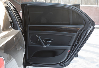 open door of the car black leather car interior