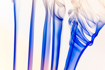 Artistic smoke of incence stick isolated at white background