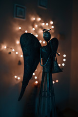 The metal angel and the light in the background