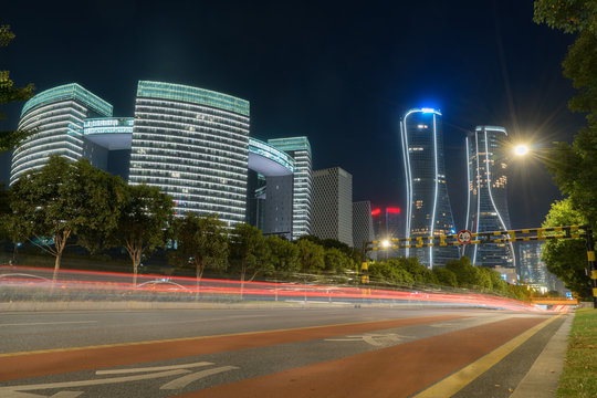 abstract image of blur motion of cars on the city road at night，Modern urban architecture in hangzhou, China