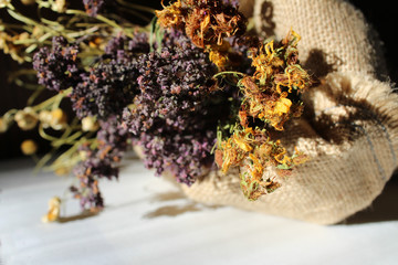 bouquet of dried herbs in the sackcloth bag