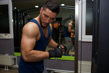 Fototapeta na wymiar young man workout in gym 