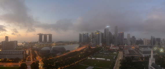Morning fog in Singapore cityscape Panorama view and skyscrapers at Marina Bay