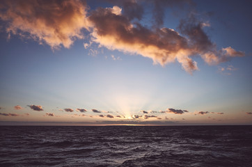 Obraz premium Sunset over the sea, retro stylized picture.