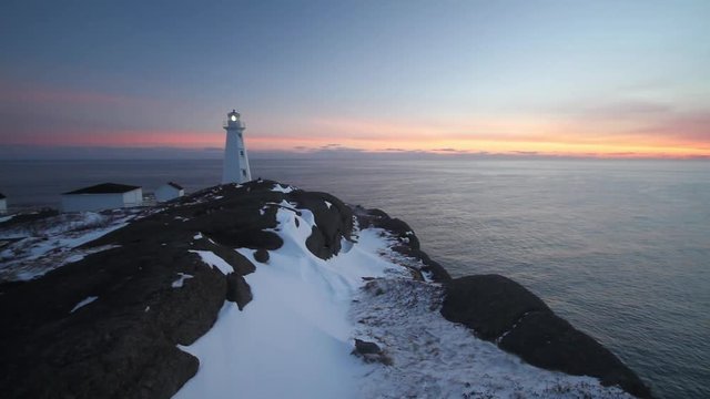 Rugged Newfoundland and Labrador coastline showing the beautiful Cape Spear light tower on a winter morning.