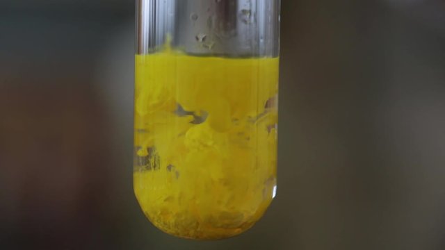 Chemistry laboratory experiment showing precipitate formation.