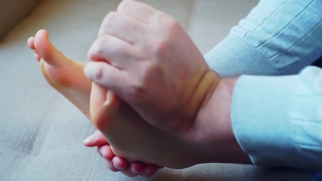 men's hands massaging children's feet. close-up